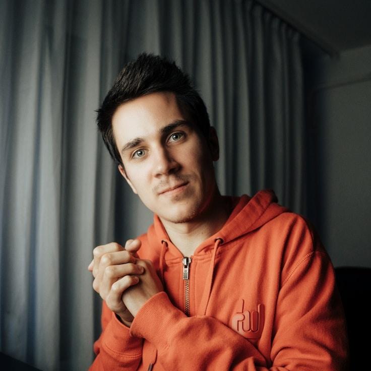 Kaveri Mehta, Lead Design Curator at SpringWaterWorks, reviewing corporate floral arrangements